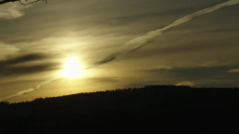 Yellow cloud band bright sun on top of forest valley Vídeo Stock 255464064