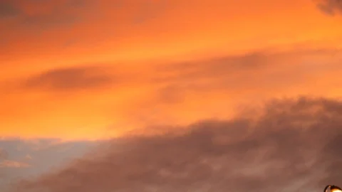 Yellow cloud moving fast sunset sky Stock Footage 96048681