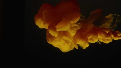 A yellow cloud slowly appears on a black background. Soft shadows. The object Video stock 237454282