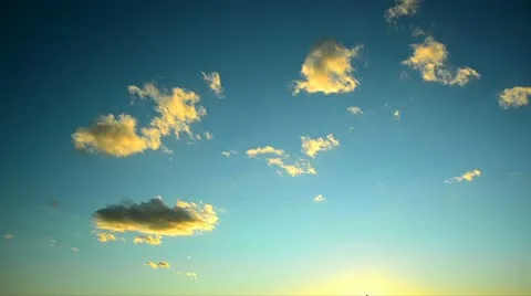 Yellow clouds disappear on blue sky Stock Footage 12518826