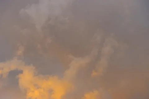 Yellow clouds during sunset. Stock Photos