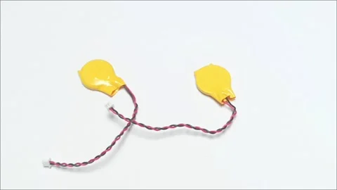 Yellow CMOS Backup Battery with Wire Connector for Laptop Fix Stock Footage 334981928