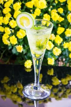 Yellow cocktail with a slice of lime Stock Photos