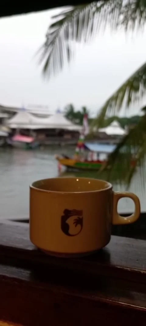 Yellow Coffee Mug on Balcony Overlooking Sea Stock Footage 331418587
