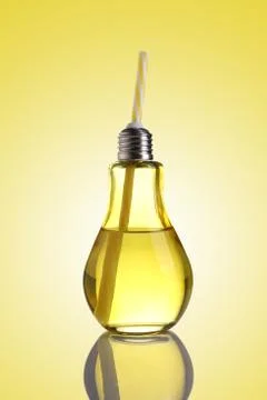 Yellow colored Bulb Shaped Drinking Glass with Straw Stock Photos