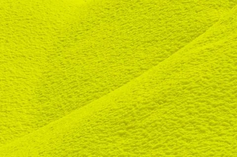 Yellow colored snow surface as background Stock Photos