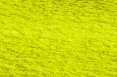 Yellow colored snow surface as background Stock Photos