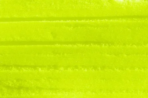 Yellow colored snow surface as background Stock Photos