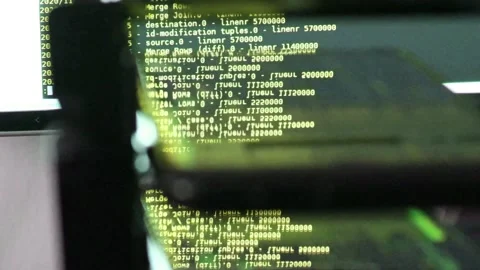 Yellow computer software code moving on a black monitor reflect on glass. Abs 스톡 동영상 143870641
