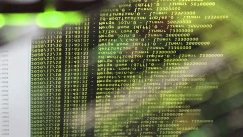 Yellow computer software code moving on a black monitor reflect on glass. Abs 스톡 동영상 144047015