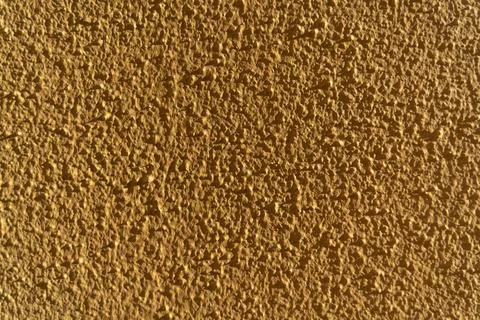 Yellow concrete wall texture for background usage. Smoky yellow background. Stock Photos