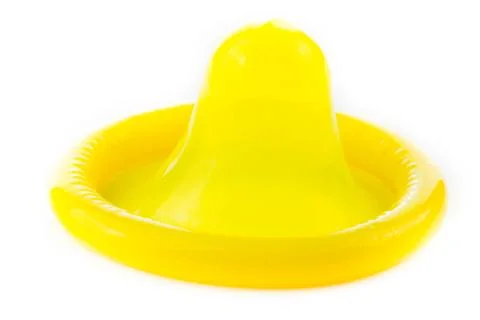 Yellow condom Stock Photos