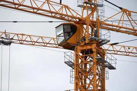 Yellow construction crane close-up.construction of houses Stock Photos