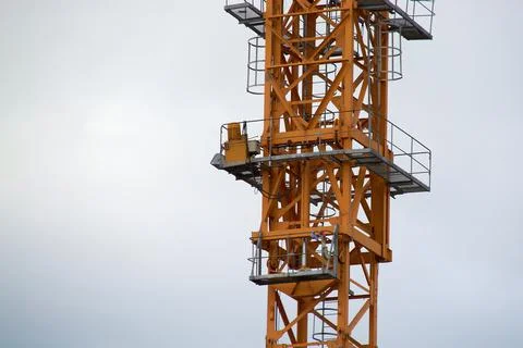 Yellow construction crane close-up.construction of houses Foto stock