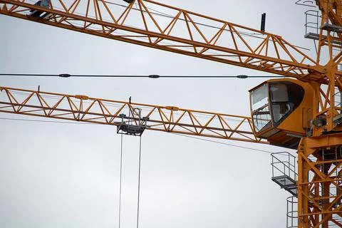 Yellow construction crane close-up.construction of houses Stock Photos