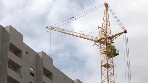 Yellow construction crane on a cold, cloudy day. Video stock 259504787
