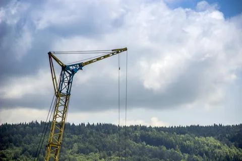 A yellow construction crane Stock Photos