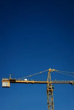 Yellow construction crane Stock Photos