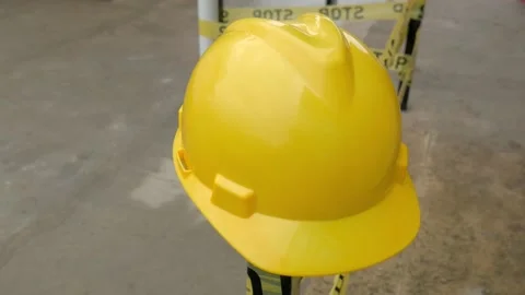 Yellow construction helmet at the construction. Personal protective equipment Stock Footage 165656540