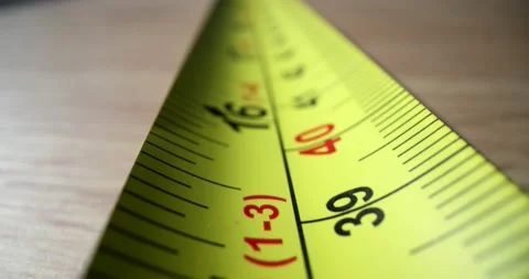 Yellow construction tape measure on table closeup Vídeo Stock 235929014