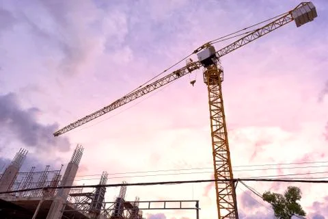 Yellow construction tower crane Stock Photos