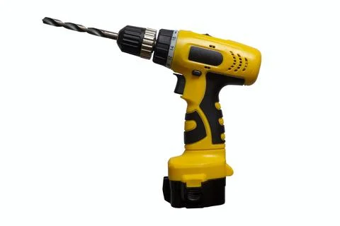 Yellow cordless drill with a drill isolate on a white background 스톡 사진