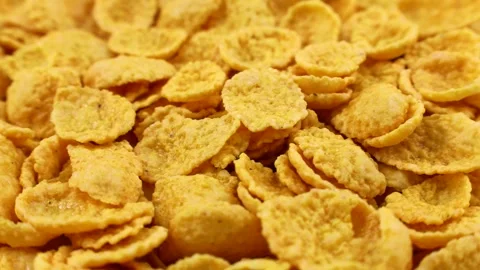 Yellow corn flakes texture circle rotation close up. Cereal bowl for breakfast Stock Footage 246848916