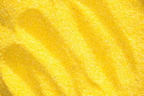 Yellow corn grits background close up Stock Photos