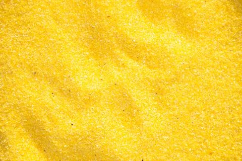 Yellow corn grits background close up Stock Photos