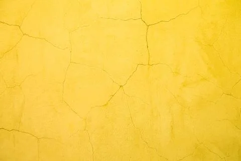 Yellow crack wall background texture Stock Photos
