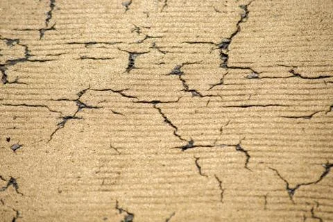 Yellow cracked background Stock Photos