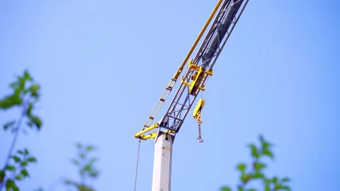 Yellow crane doing work and moving weights. Construction concept. Stock Footage 219235828