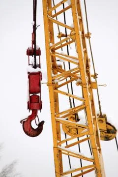 Yellow crane with red hook Stock Photos