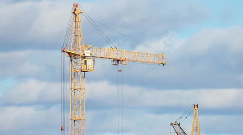 Yellow crane rotating - clouds on blue sky Stock Footage 879772