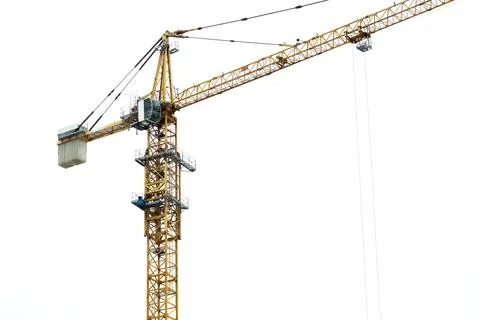Yellow crane on a white sky background Stock Photos