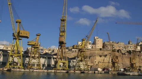 YELLOW CRANES DRY DOCKS SENGLEA MALTA Video stock 64556238