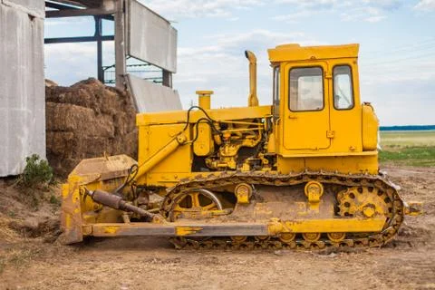Yellow crawler tractor Stock Photos