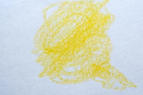 Yellow crayon scribble on white paper Stock Photos
