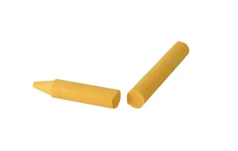 Yellow crayons on a white background. Stock Photos