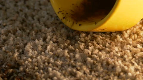 Yellow cup of coffee falling on grey seamless carpet, closeup texture Stock Footage 122492025