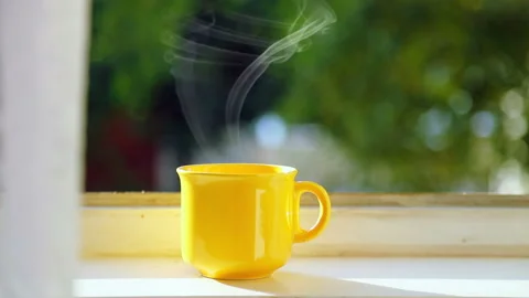 Yellow Cup of Coffee on the Windowsill Stock-Footage 106484977