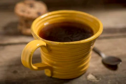 Yellow Cup Containing Warm Coffee or Tea Stock Photos