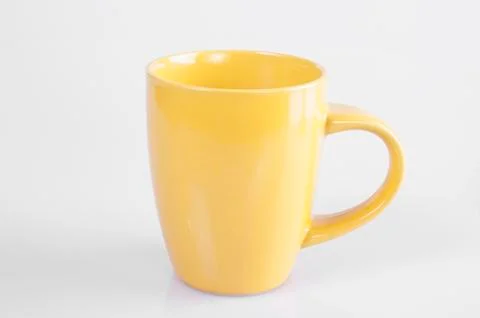 Yellow cup Stock Photos