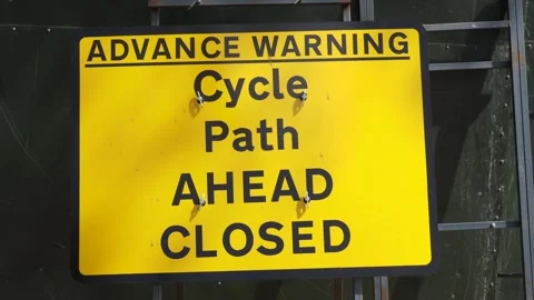 Yellow Cycle Path Ahead Closed Sign, UK Stock Footage 240235955