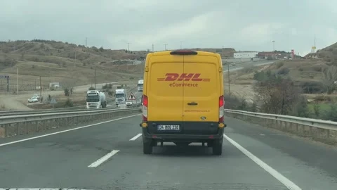 Yellow delivery van on highway transporting packages, suitable for logistic.. Stock Footage 336399534