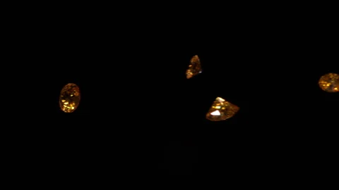 Yellow diamonds falling in slow motion HD Stock Footage 253068034