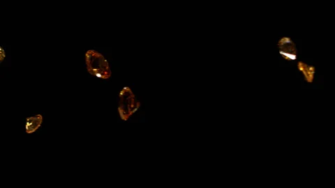Yellow diamonds falling in slow motion 4K 4 Stock Footage 253129384
