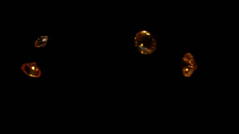 Yellow diamonds falling in slow motion 4K 2 Stock Footage 253130494