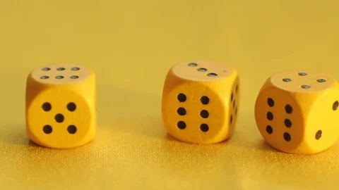 The yellow dice have a three, a four, and a six Stock Footage 89322340