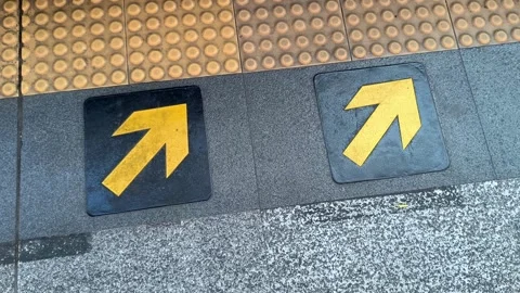 Yellow Direction Arrows on Train Station Floor Stock Footage 324143374